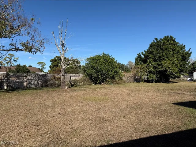 a pathway of a house with a yard