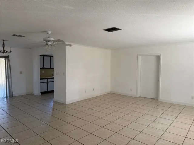 a view of an empty room and window