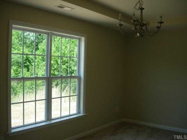 1300 Rushing Creek Parkway Raleigh, NC 27610 - Photo 7 of 12 Formal Dining Room with Tray Ceiling