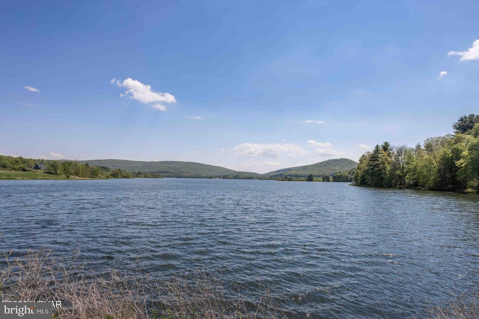 92 Easton Road Trout Run, PA 17771 - Photo 20 of 108 Serene lake embraced by rolling hills.