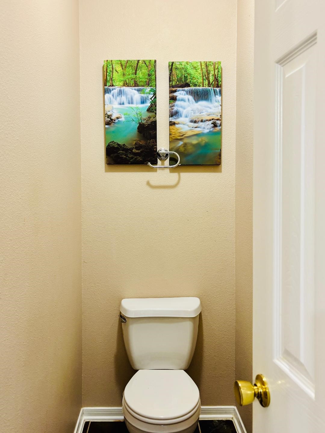 9947 Valance Way Conroe, TX 77385 - Photo 19 of 48 a white toilet sitting next to a shower curtain