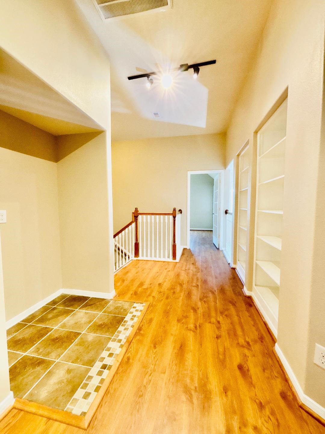 9947 Valance Way Conroe, TX 77385 - Photo 21 of 48 a bedroom with a bed and a painting on the wall