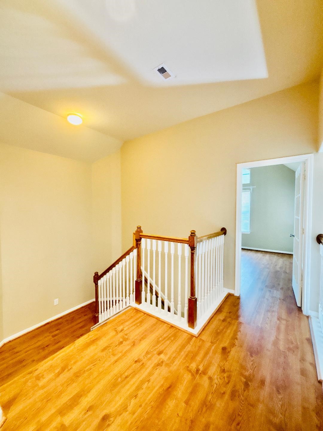 9947 Valance Way Conroe, TX 77385 - Photo 22 of 48 a view of an empty room with wooden floor