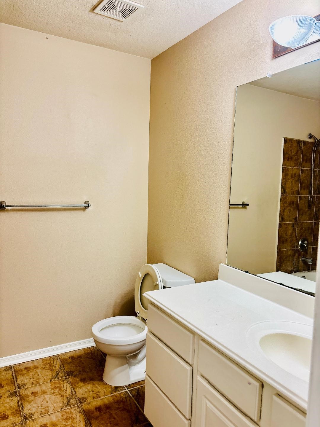 9947 Valance Way Conroe, TX 77385 - Photo 36 of 48 a bathroom with a sink a toilet and vanity