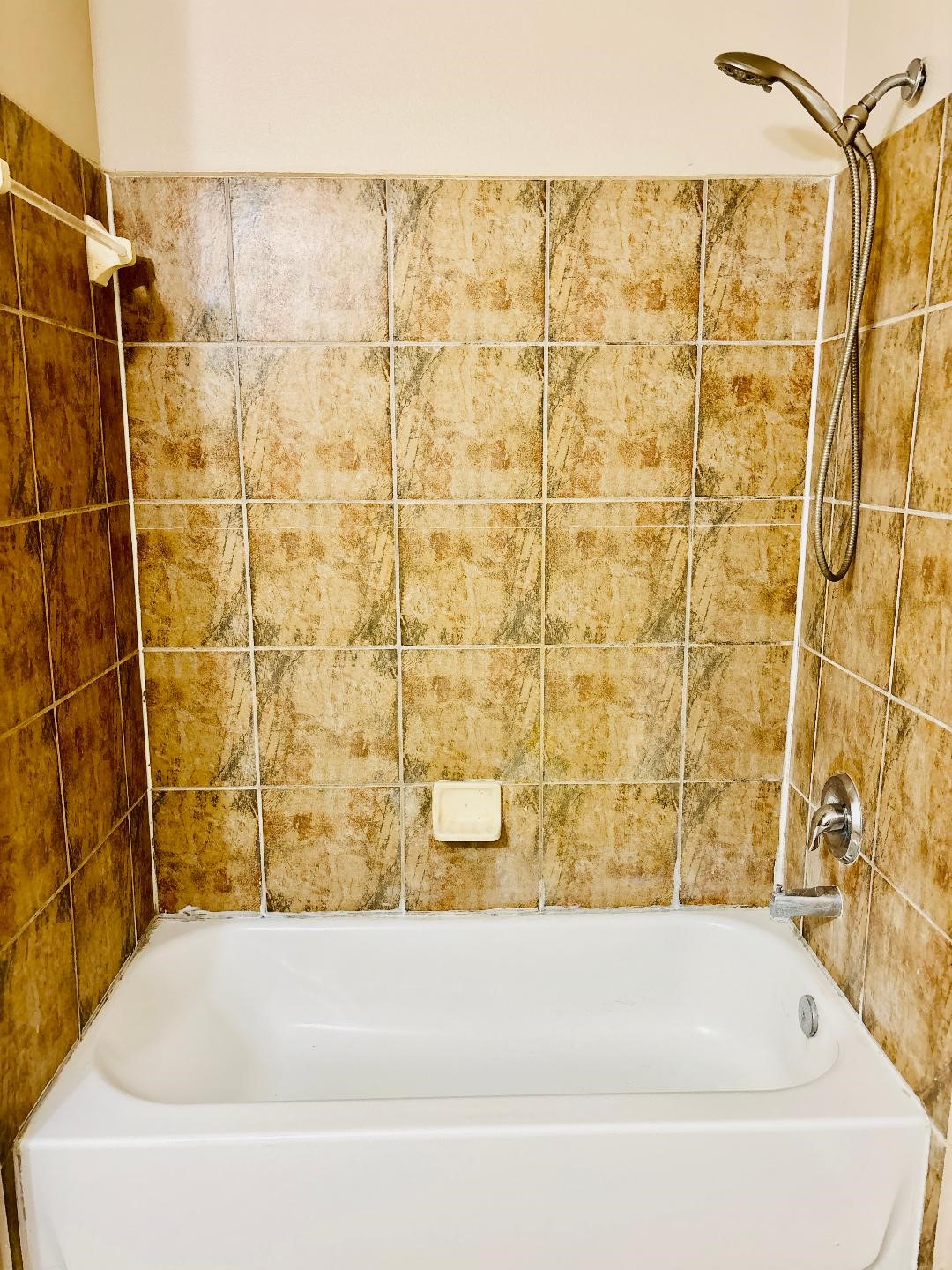 9947 Valance Way Conroe, TX 77385 - Photo 37 of 48 a bathroom with a bathtub and shower