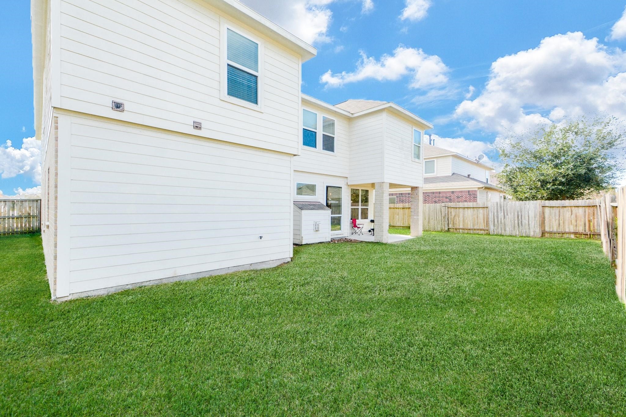 9947 Valance Way Conroe, TX 77385 - Photo 45 of 48 front view of a house with a yard