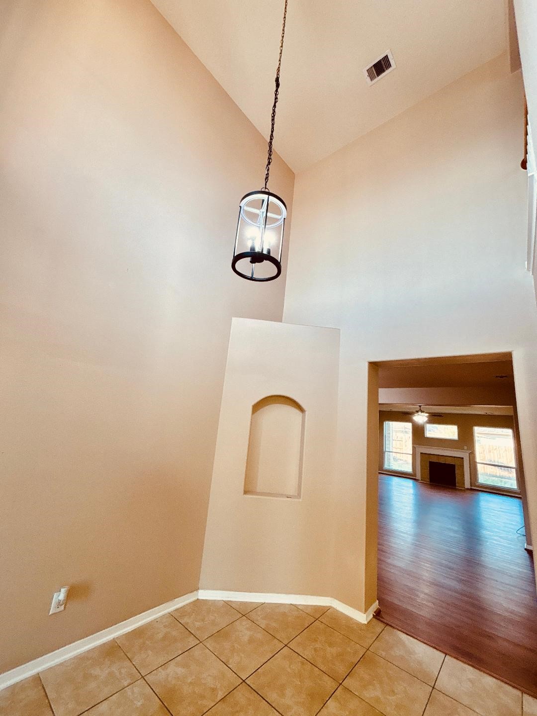 9947 Valance Way Conroe, TX 77385 - Photo 5 of 48 a room with wooden floor and white walls