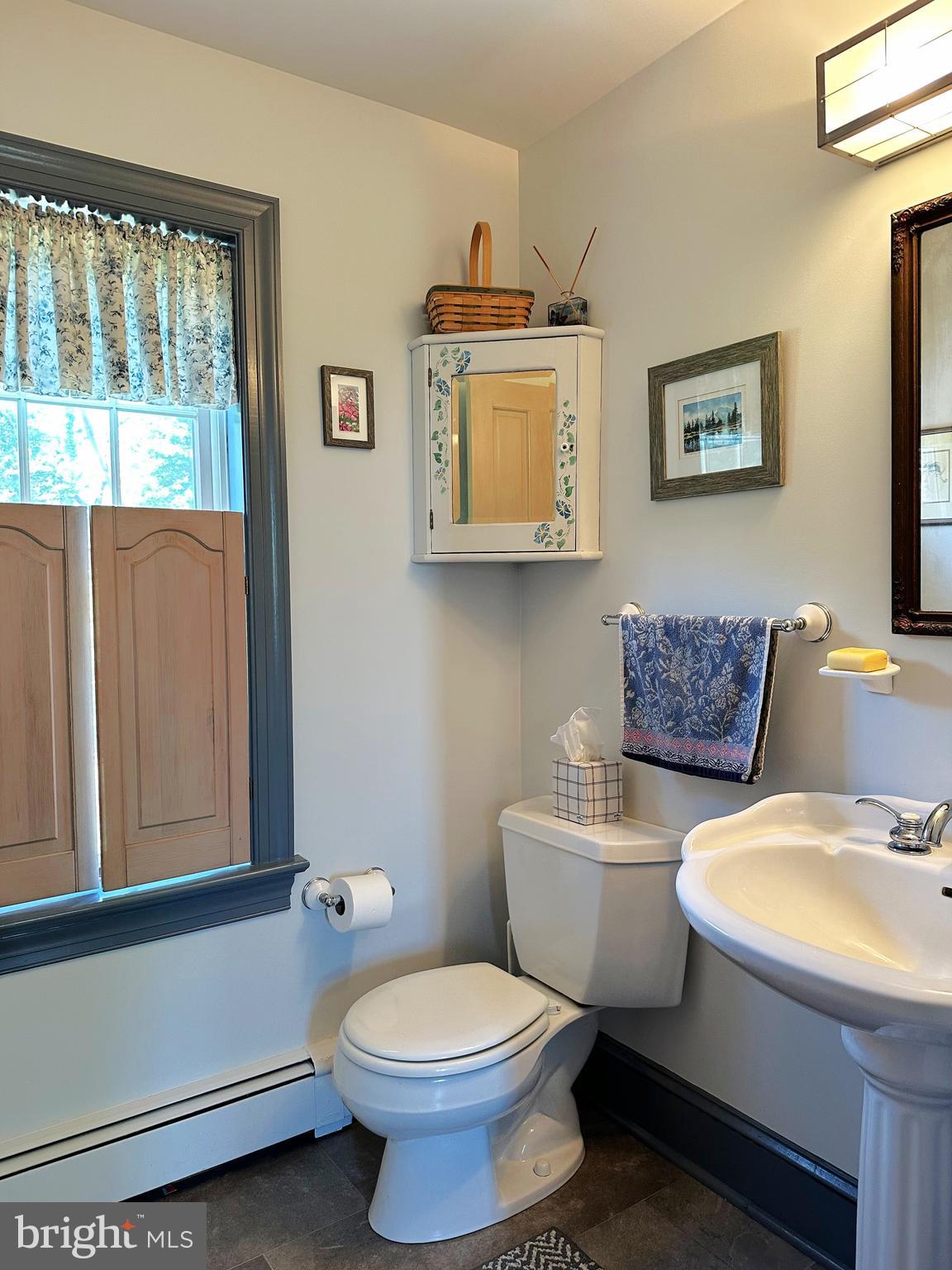 2382 Bergey Road Harleysville, PA 19438 - Photo 31 of 52 a white toilet sitting next to a bathroom sink