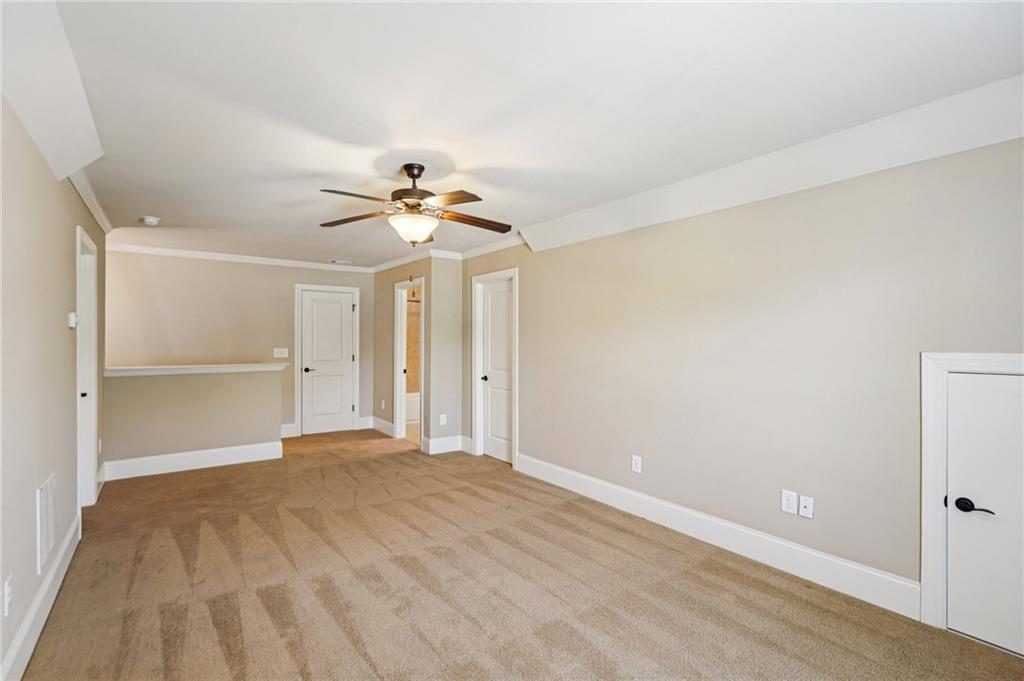 488 Townsend Street Grayson, GA 30017 - Photo 32 of 40 a view of an empty room with a ceiling fan