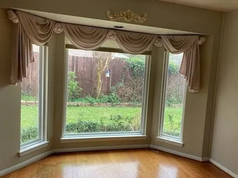 a view of a porch with furniture and a window