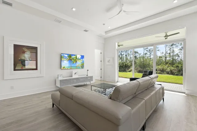 a living room with couch and a large window