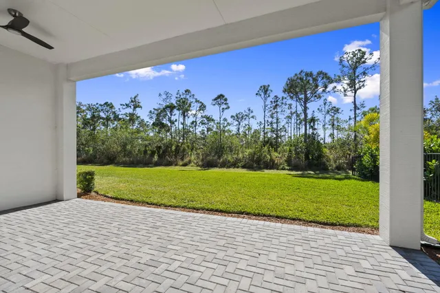 a view of a room with a yard and potted plants