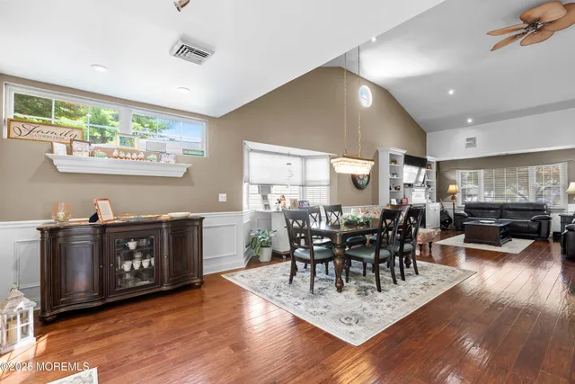 a view of bathroom with a sink a toilet and vanity