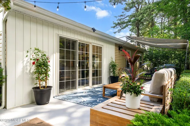 a view of a backyard with sitting area
