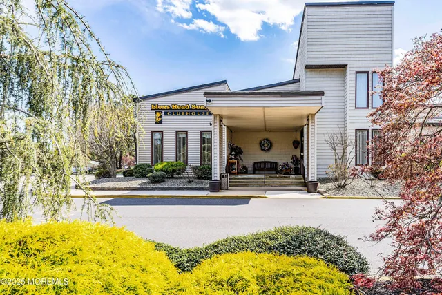 a swimming pool with an outdoor seating and yard