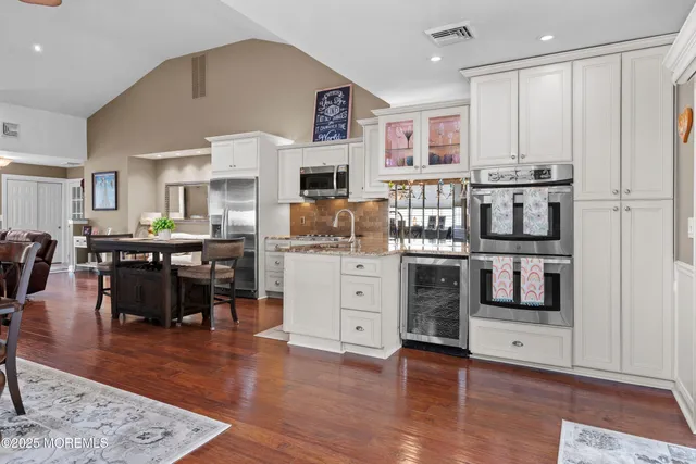 a living room with furniture and large window