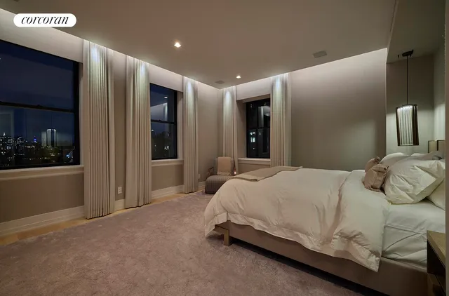 a bedroom with a bed and lamp