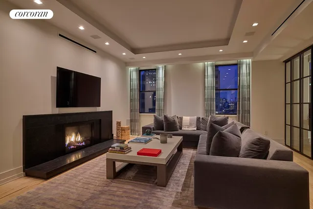 a living room with furniture fireplace and a flat screen tv