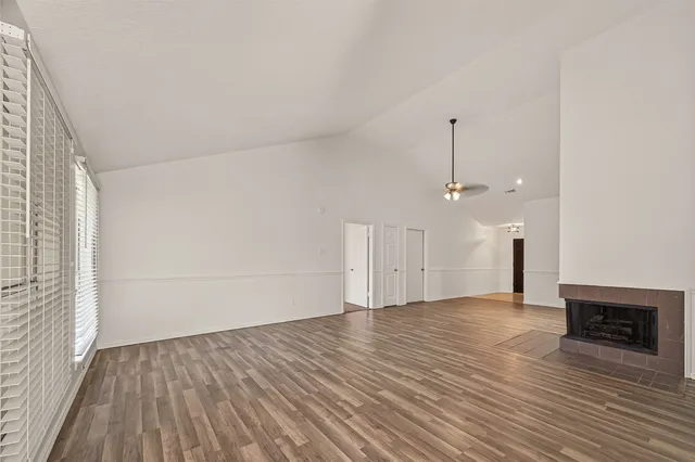 a large kitchen with cabinets and stainless steel appliances
