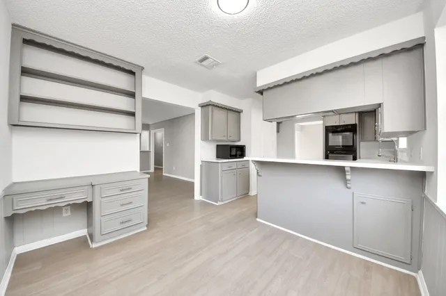 walk in closet with white walls