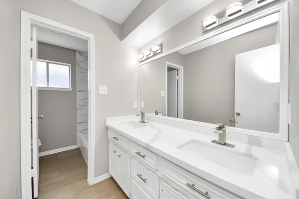 a bathroom with a bathtub and a sink