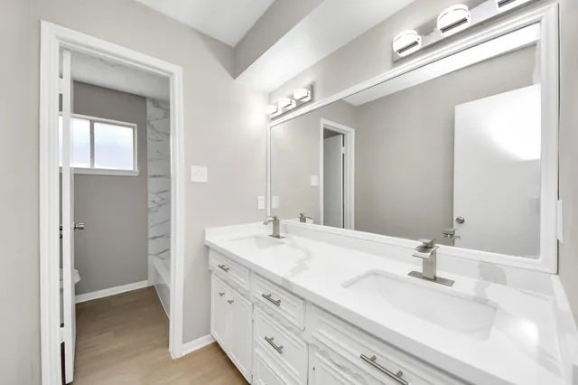 a bathroom with a bathtub and a sink
