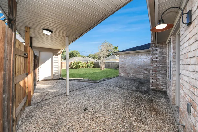 a view of a backyard with plants and a garden