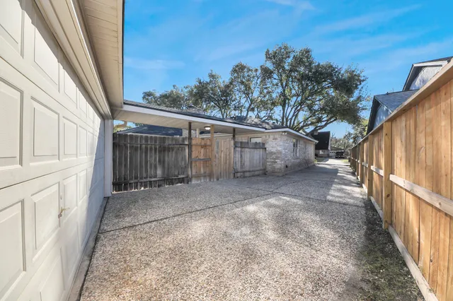 an aerial view of a houses with outdoor space