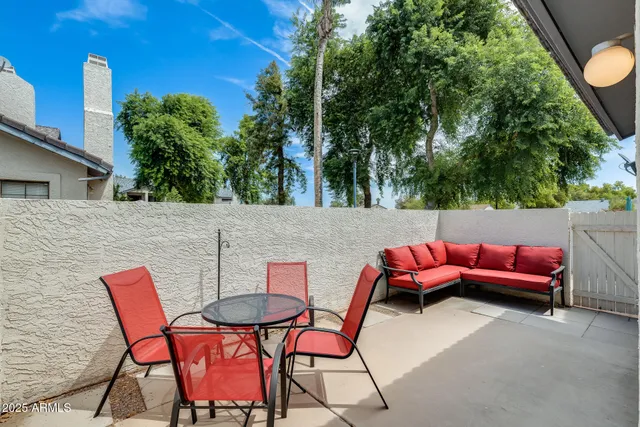 a view of a patio with couches table and chairs