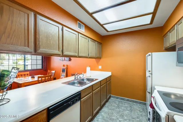 a utility room with a sink a washer and dryer