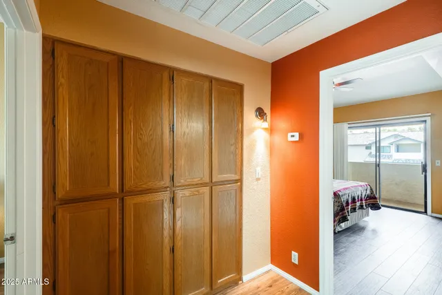 a view of an entryway with wooden floor