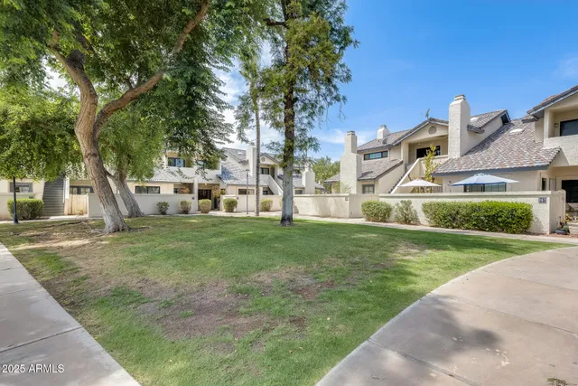 a view of a house with pool porch and next to a yard