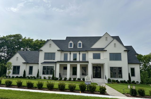front view of residential houses with a yard