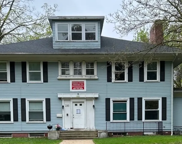 a front view of a building with windows