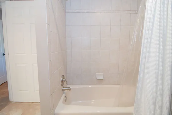 a close up of a bathtub curtain