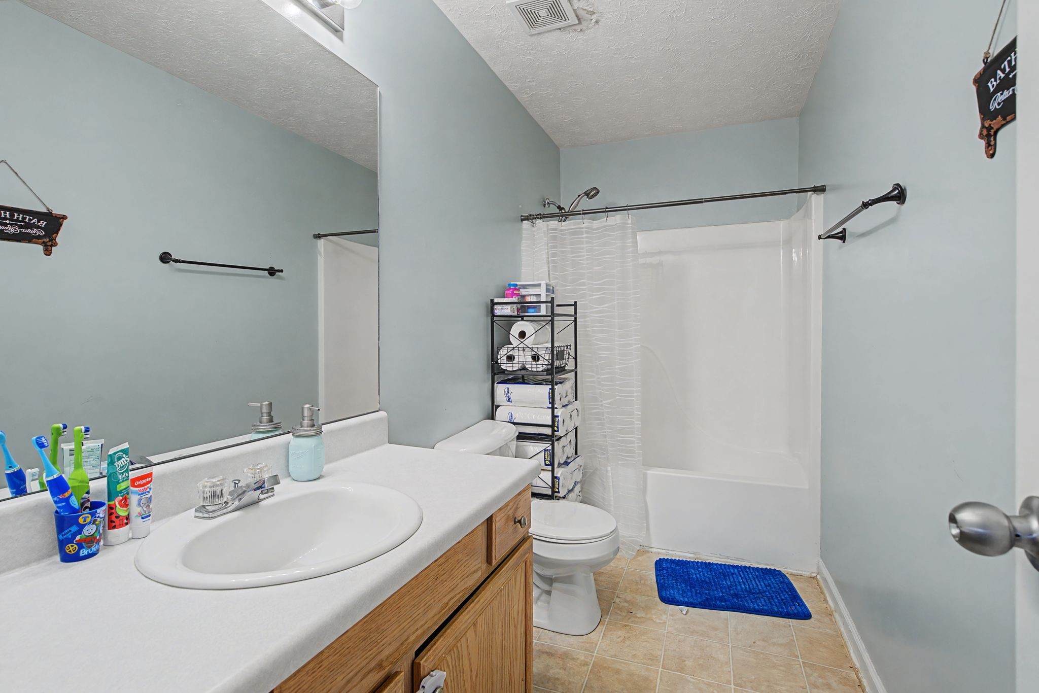 105 Cora Street Portland, TN 37148 - Photo 12 of 31 a bathroom with a sink toilet and shower