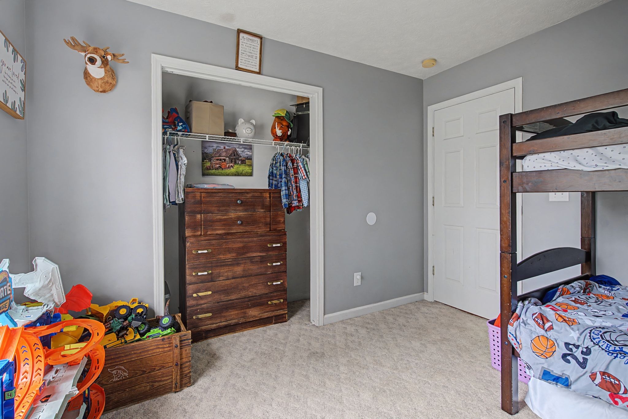 105 Cora Street Portland, TN 37148 - Photo 16 of 31 a bedroom with a bed and closet