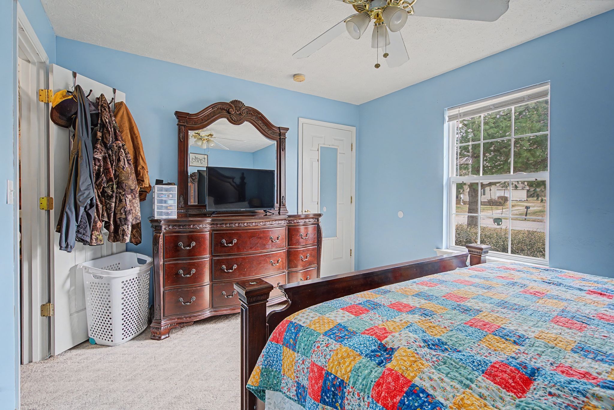 105 Cora Street Portland, TN 37148 - Photo 18 of 31 a bedroom with a bed and a television