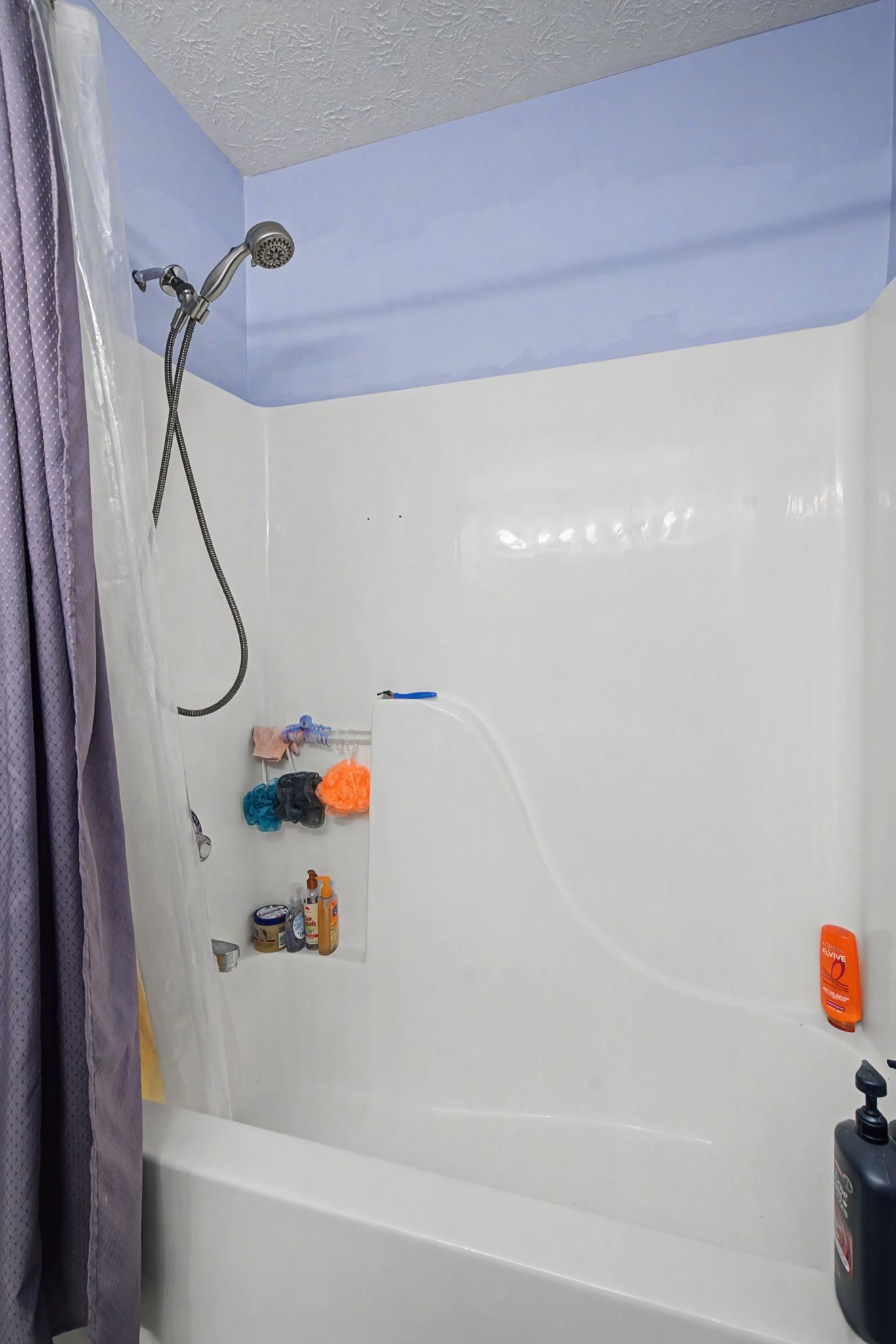 105 Cora Street Portland, TN 37148 - Photo 20 of 31 a bathroom with a bath tub and a shower