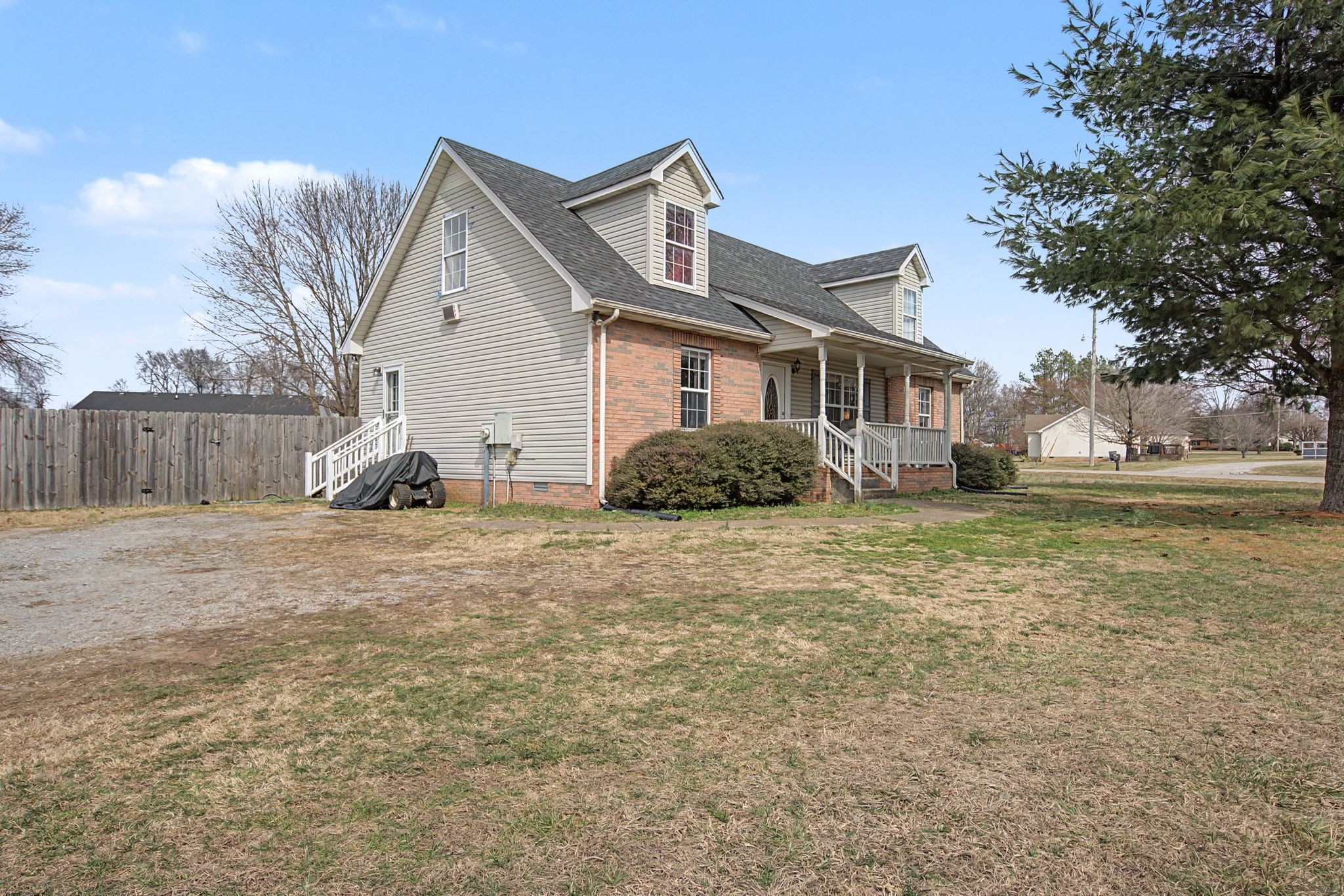 105 Cora Street Portland, TN 37148 - Photo 2 of 31 a front view of a house with garden