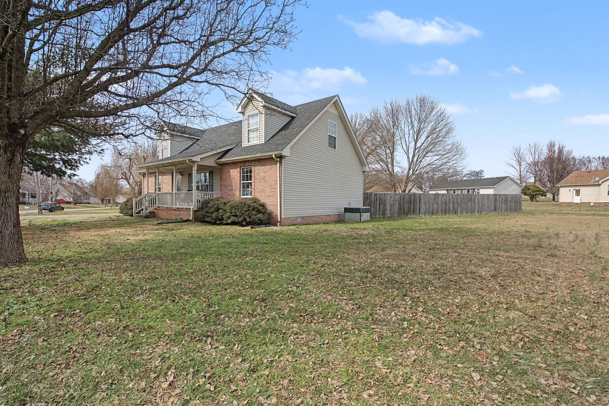 105 Cora Street Portland, TN 37148 - Photo 3 of 31 a front view of house with yard and trees