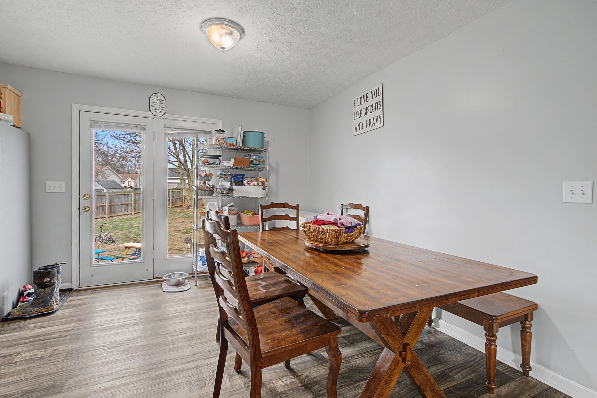 105 Cora Street Portland, TN 37148 - Photo 7 of 31 a view of a dining room with furniture and wooden floor