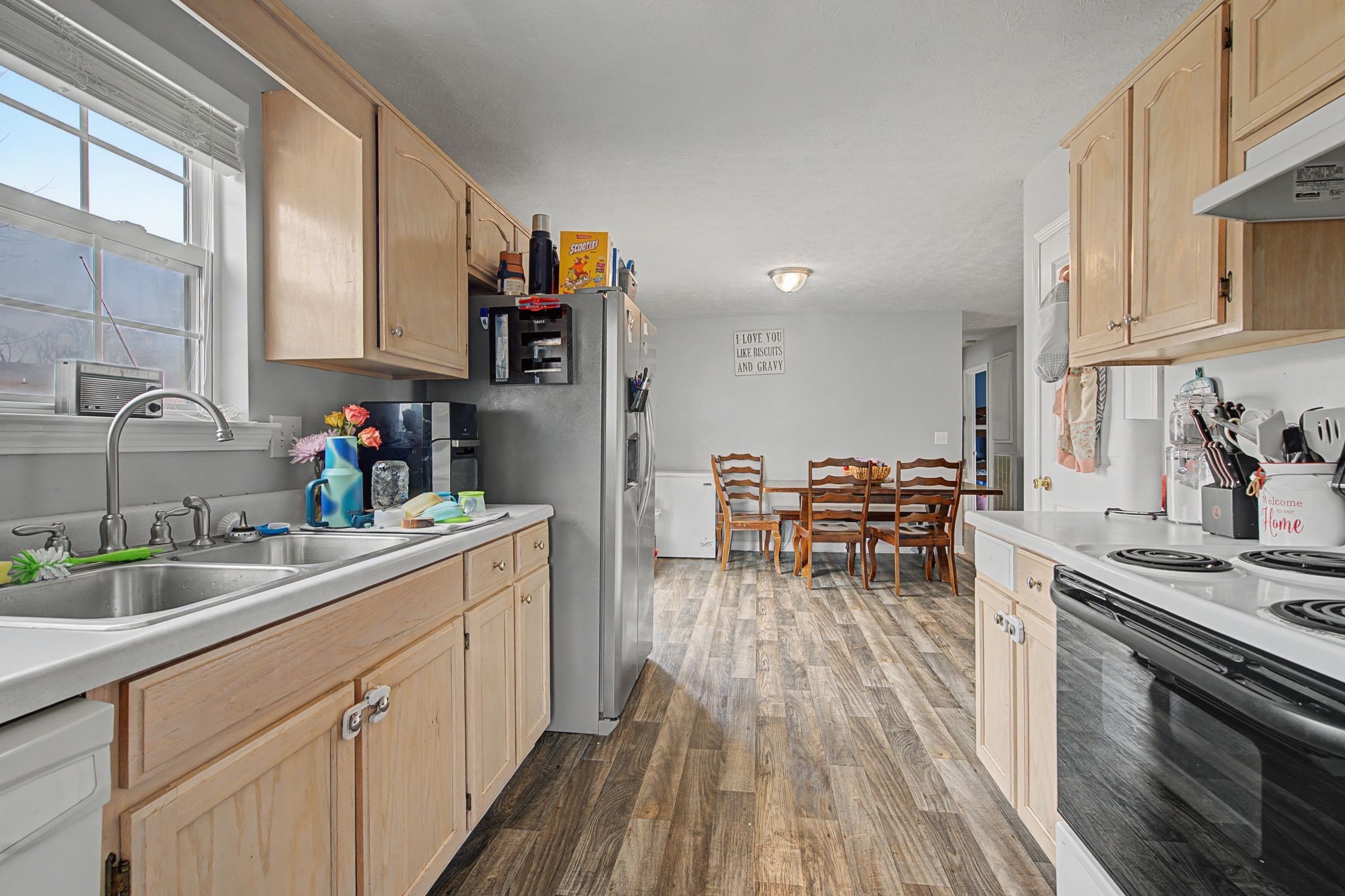 105 Cora Street Portland, TN 37148 - Photo 10 of 31 a kitchen with a sink and cabinets