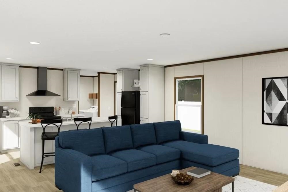 200 West 20th Street, Unit A146 Rifle, CO 81650 - Photo 2 of 7 a living room with furniture and a refrigerator