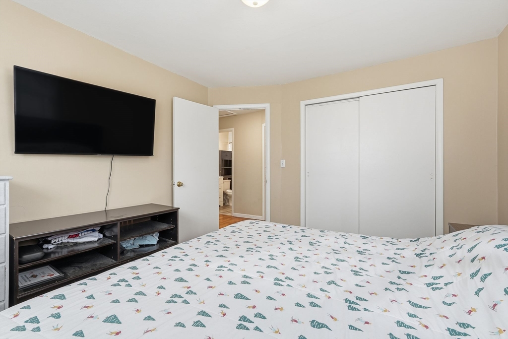30 Jerilis Drive Springfield, MA 01119 - Photo 19 of 42 a bedroom with a bed and a flat screen tv