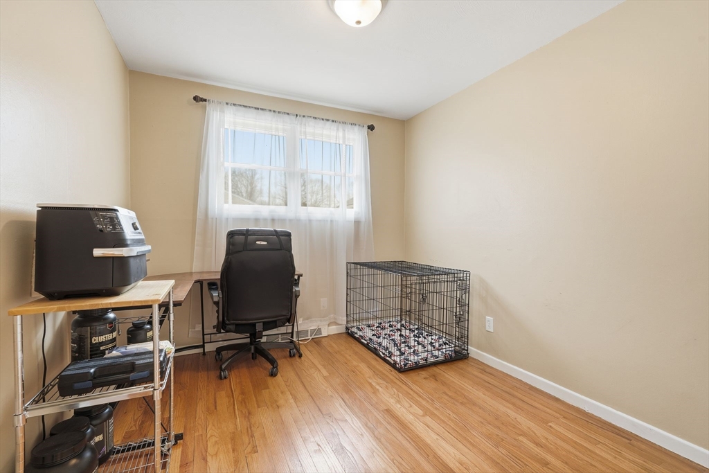 30 Jerilis Drive Springfield, MA 01119 - Photo 22 of 42 a view of a workspace with furniture and wooden floor