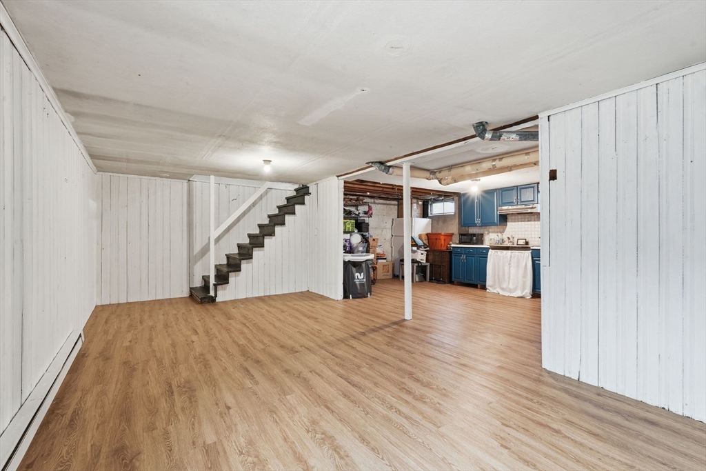 30 Jerilis Drive Springfield, MA 01119 - Photo 29 of 42 a view of empty room with wooden floor and stairs