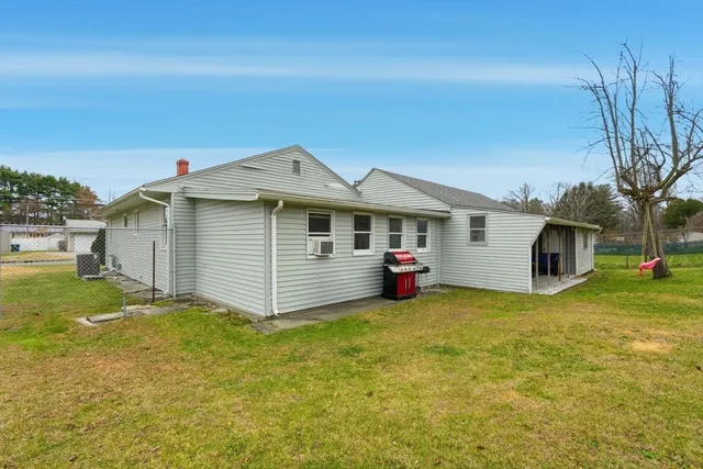 a front view of house with yard and seating area