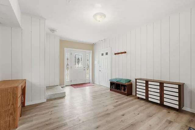 a living room with furniture and kitchen view