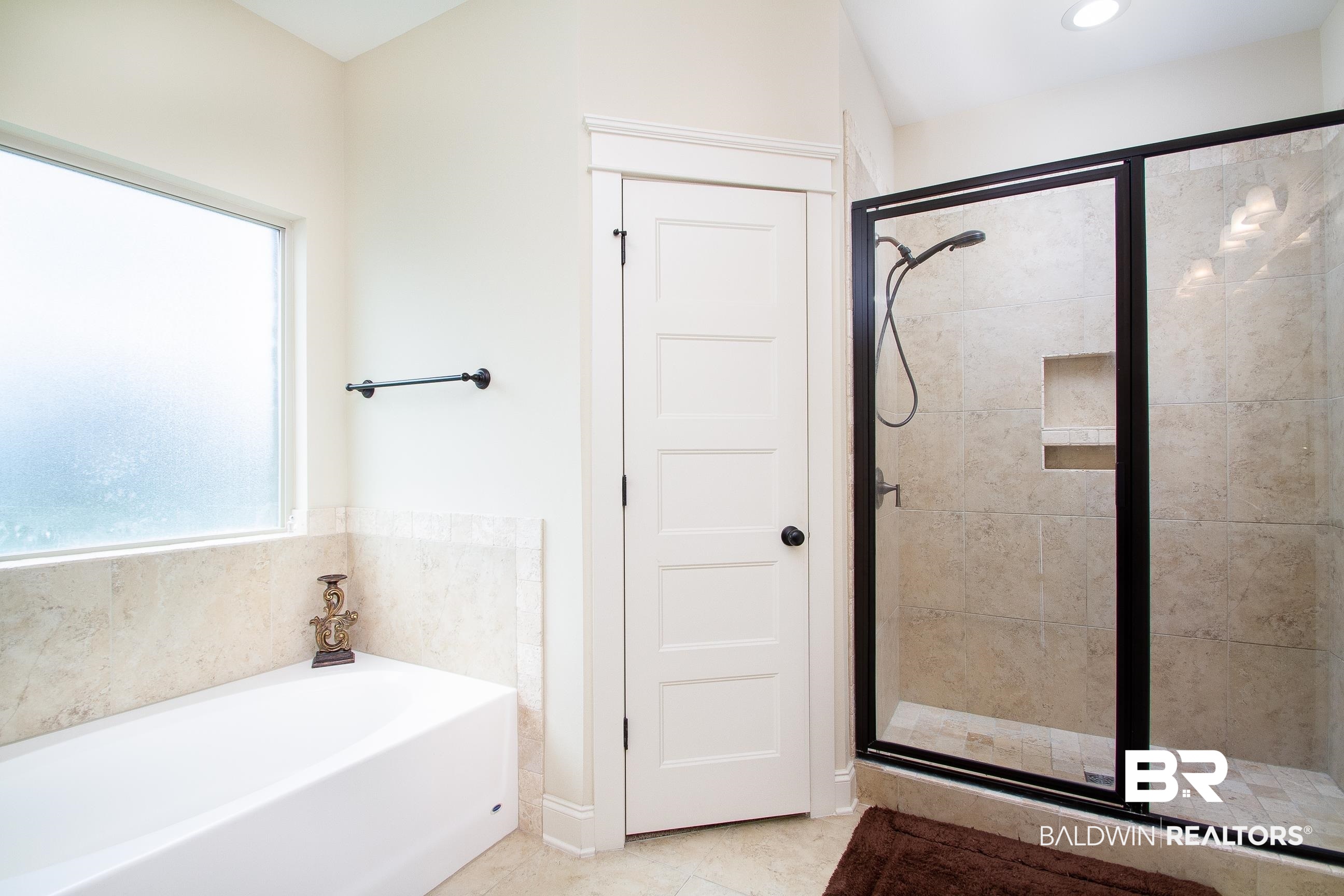8625 Rosedown Lane Daphne, AL 36526 - Photo 17 of 29 Bathroom featuring separate shower and tub and tile patterned floors